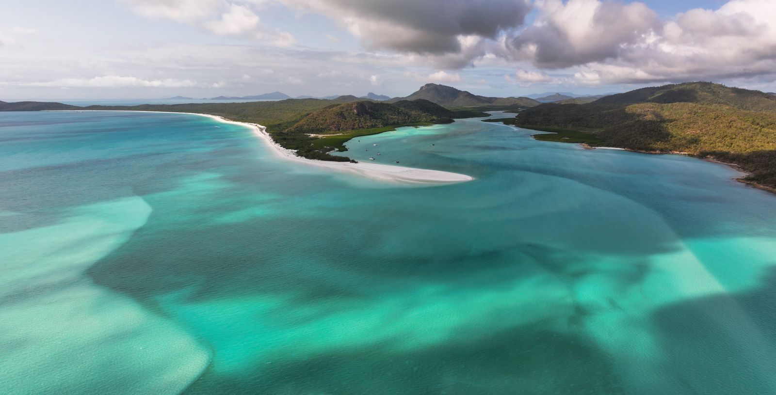 Swirling white sand and turquoise water in the Whitsunday Islands, Australia