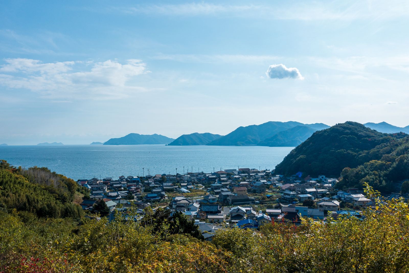 Green hills, a harbor town and islands of the Seto Inland Sea at Onomichi, a region visited on small ship cruises in Japan