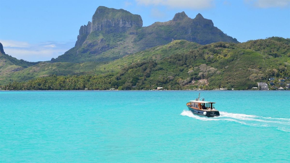 Launch crossing a lagoon at Bora Bora